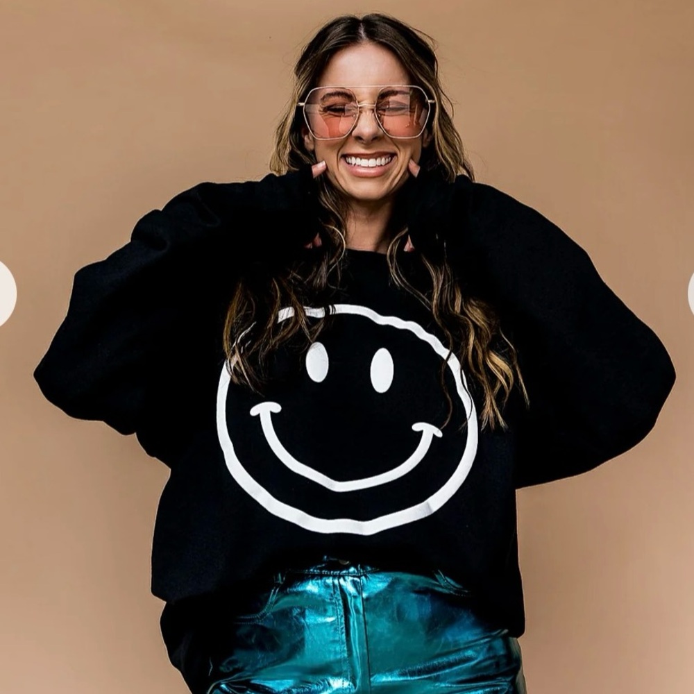 Dressed in LALA oversized crew smiley the world needs your magic sweatshirt